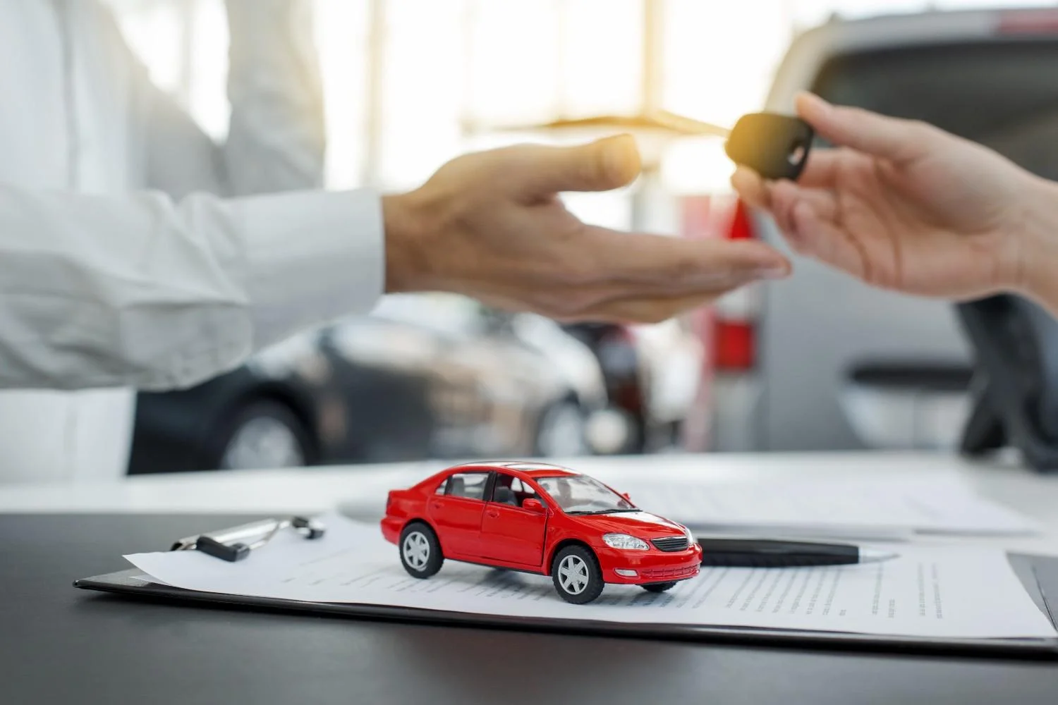 A driver reviewing coverage details beside a parked car